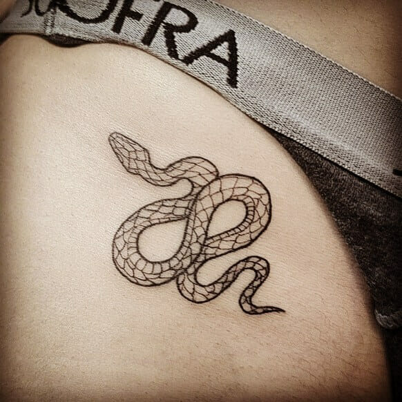 Bikini line tattoo with snake design