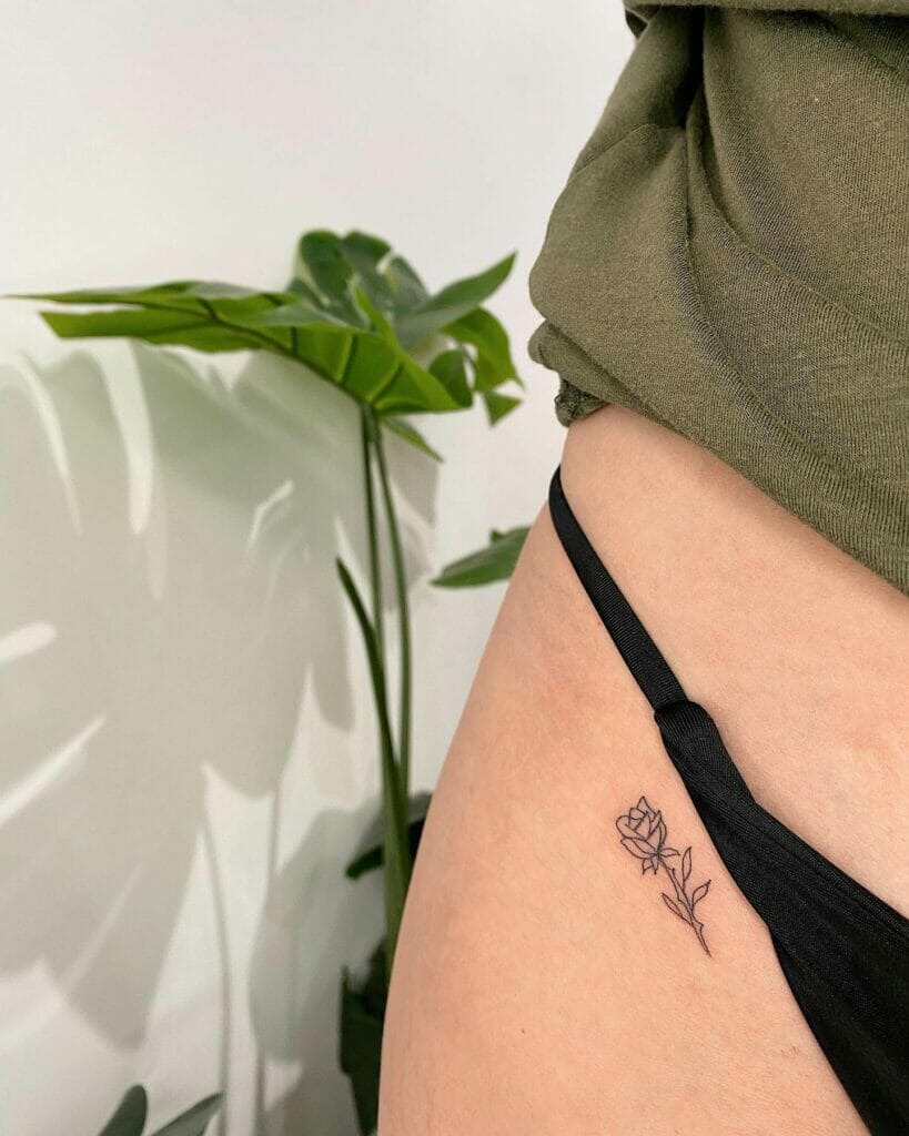 Rose with stem bikini line tattoo