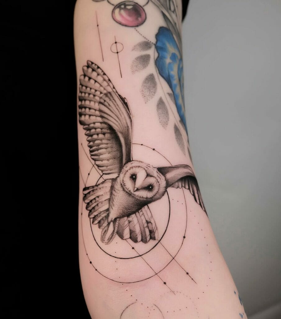 Realistic flying owl tattoo