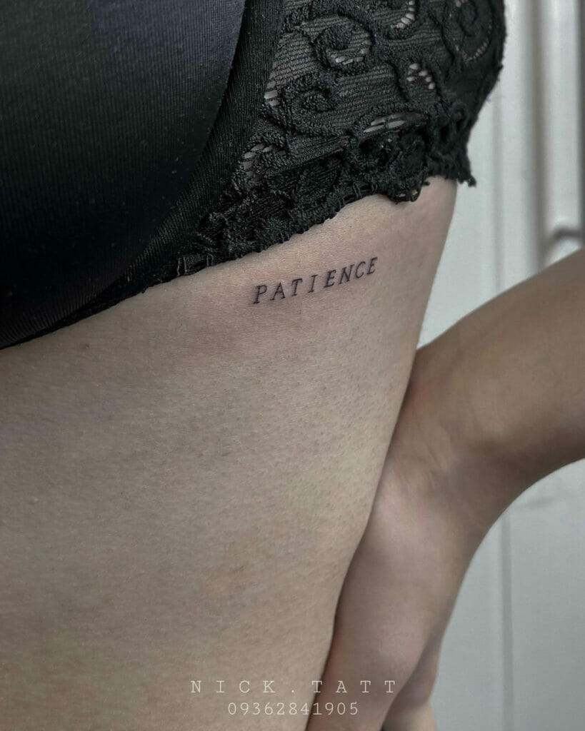 Bikini quote tattoo in black ink