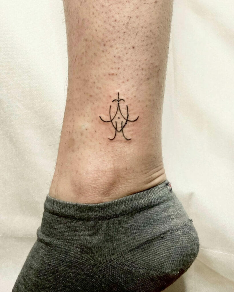 Small intricate pattern ankle tattoo