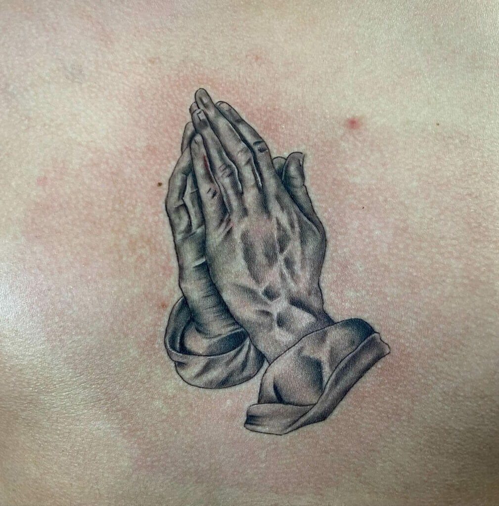 Praying hands black and gray tattoos