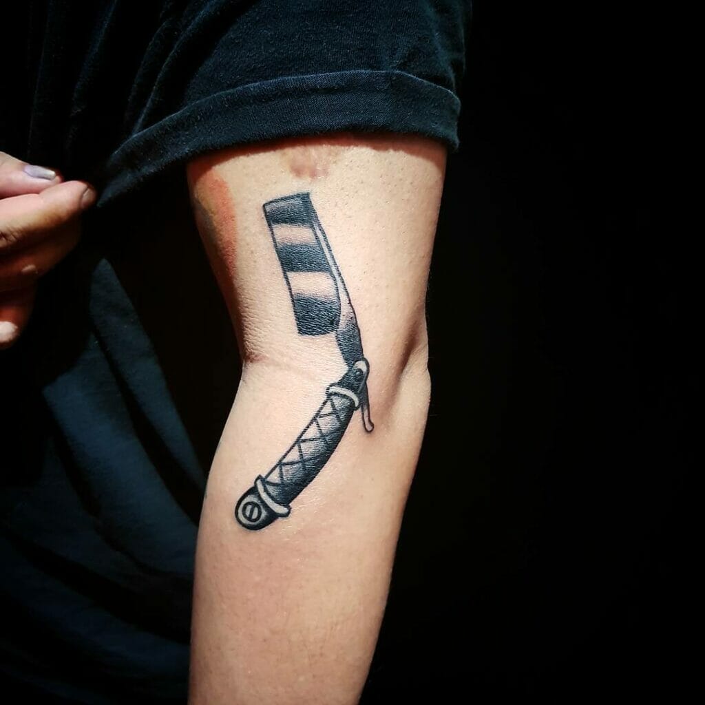 Black and white folding razor tattoo