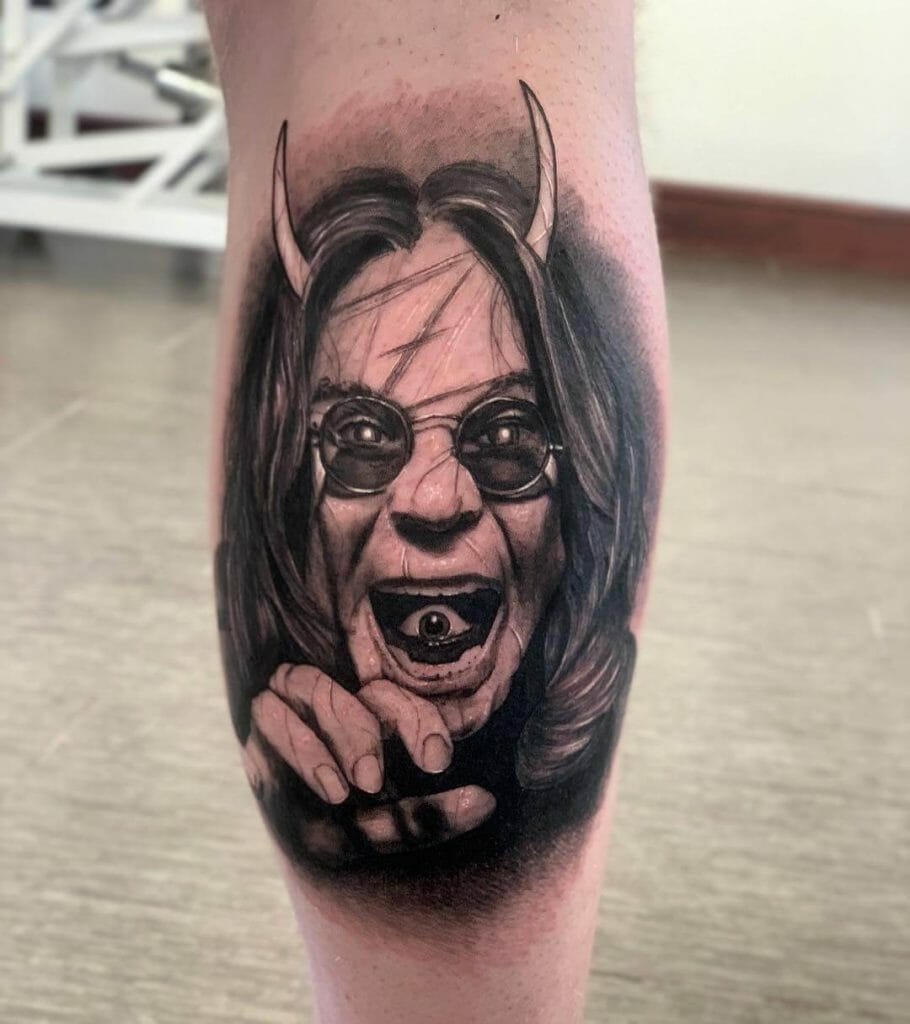 Black and gray Ozzy Osbourne with horn tattoo