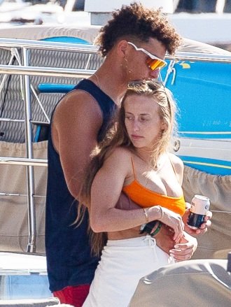 *EXCLUSIVE* CABO SAN LUCAS, MEXICO - Patrick Mahomes is seen shirtless on a yacht with friends in Cabo San Lucas.  The Kansas City Chiefs quarterback has been enjoying a getaway with friends and girlfriend Brittany Matthews in Cabo after welcoming son Sterling Skye Mahomes in February!  Image: Patrick Mahomes, Brittany Matthews Contains children Please pixelate face prior to publication*