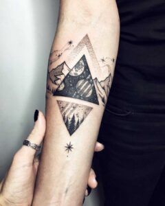 Cosmic triangle tattoo by Sasha Tattooing