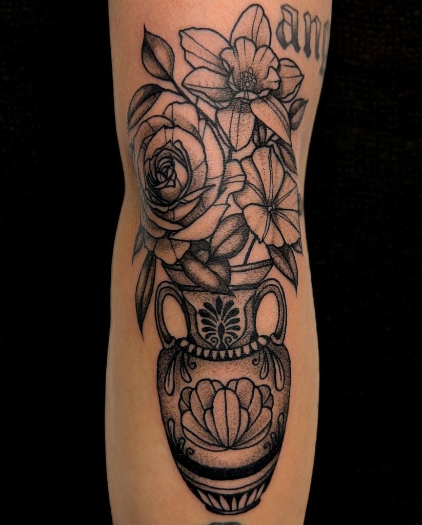 Nice morning glory tattoo with vase designs