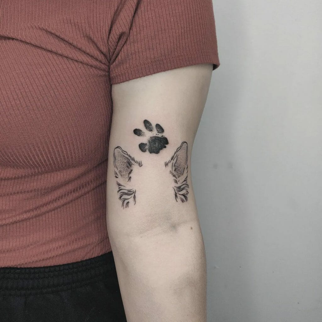 Dog ear and paw tattoo