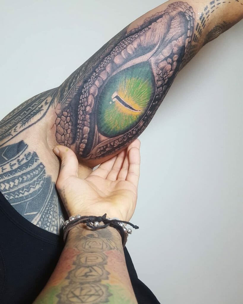 Dragon eye tattoo on arm