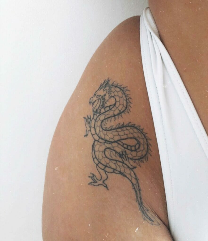 Dragon tattoo on bikini line thigh tattoos