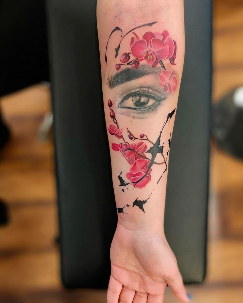 Eye tattoo ideas on arm with cherry blossom