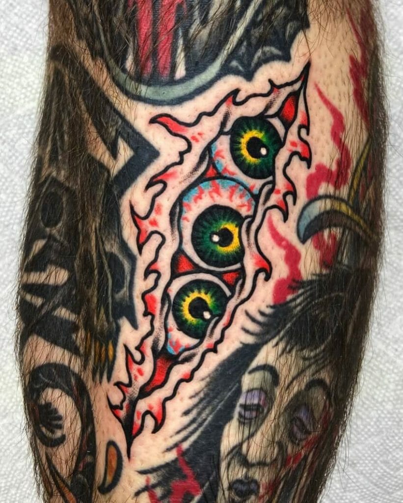 Eyeball in torn skin tattoo