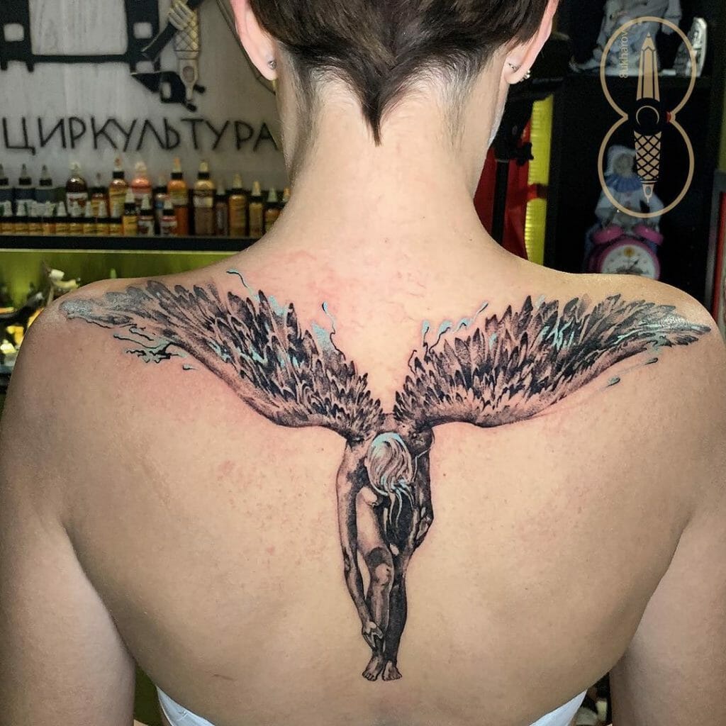 Fallen angel tattoo on the back