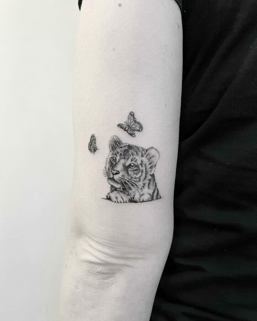 Feminine minimalist tiger tattoo