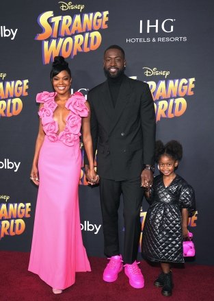 Gabrielle Union (L), US basketball player Dwyane Wade (C) and daughter Kaavia James Union Wade (R) attend the premiere of 