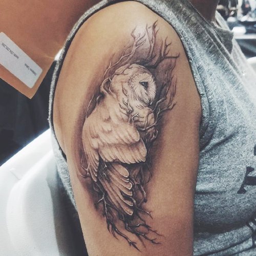 Kristin Maldonaldo owl tattoo on upper arm