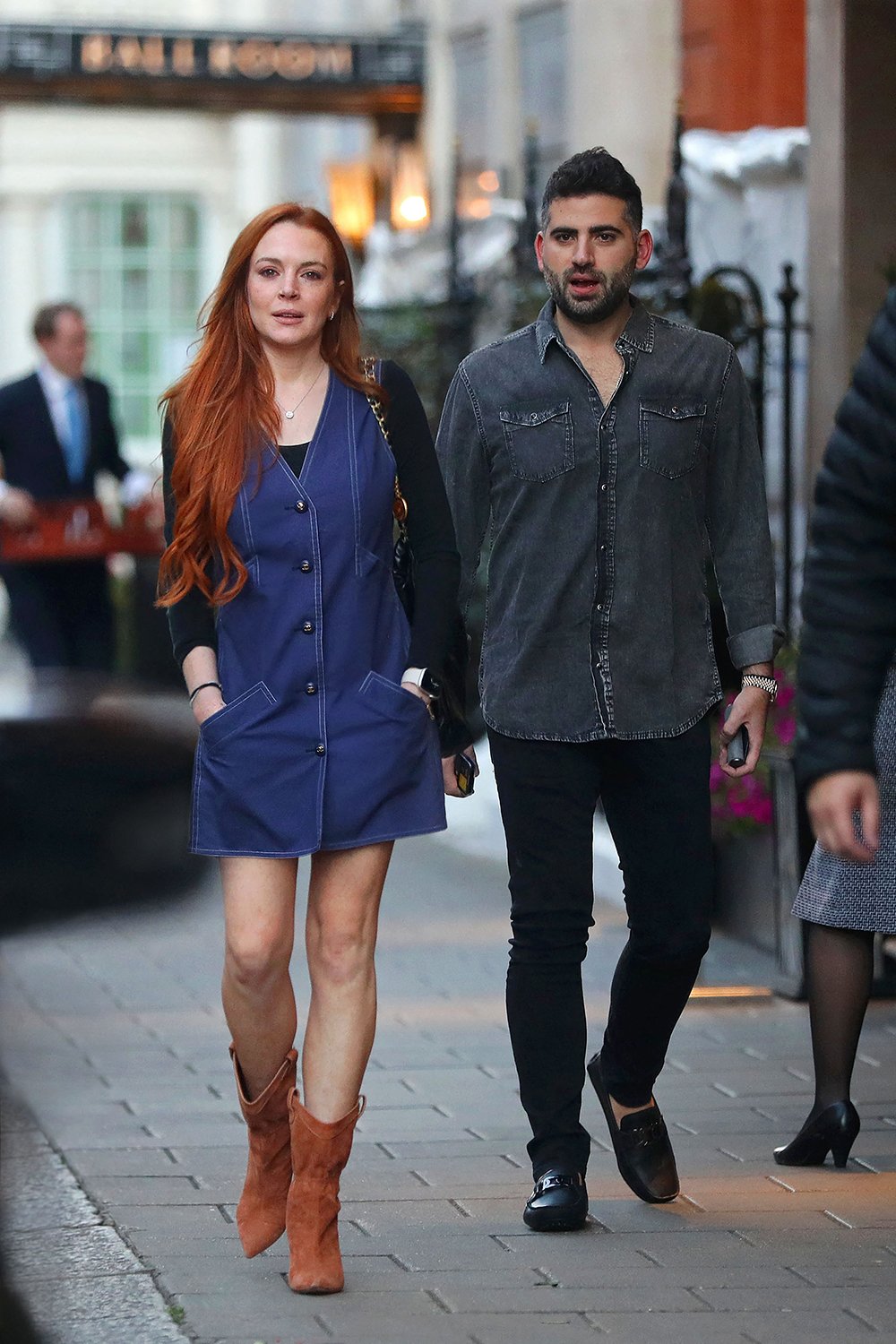 EXCLUSIVE: Lindsay Lohan looks so happy and healthy as she steps out in London for their first public appearance together, following her secret marriage to new husband Bader Shammas.  Lohan put on a radiant show as she joined husband Bader Shammas for a day out in London.  The 36-year-old actress looked sensational in a sleeveless buttoned Chanel dress, a handbag and suede ankle boots as she strolled through the capital.  The newlyweds beamed as they took the time to snap some selfies with fans.  Shammas is Vice President of Dubai-based bank Credit Suisse.  August 24, 2022 Pictured: Lindsay Lohan, Bader Shammas.  Photo credit: MEGA TheMegaAgency.com +1 888 505 6342 (Mega Agency TagID: MEGA889196_001.jpg) [Photo via Mega Agency]