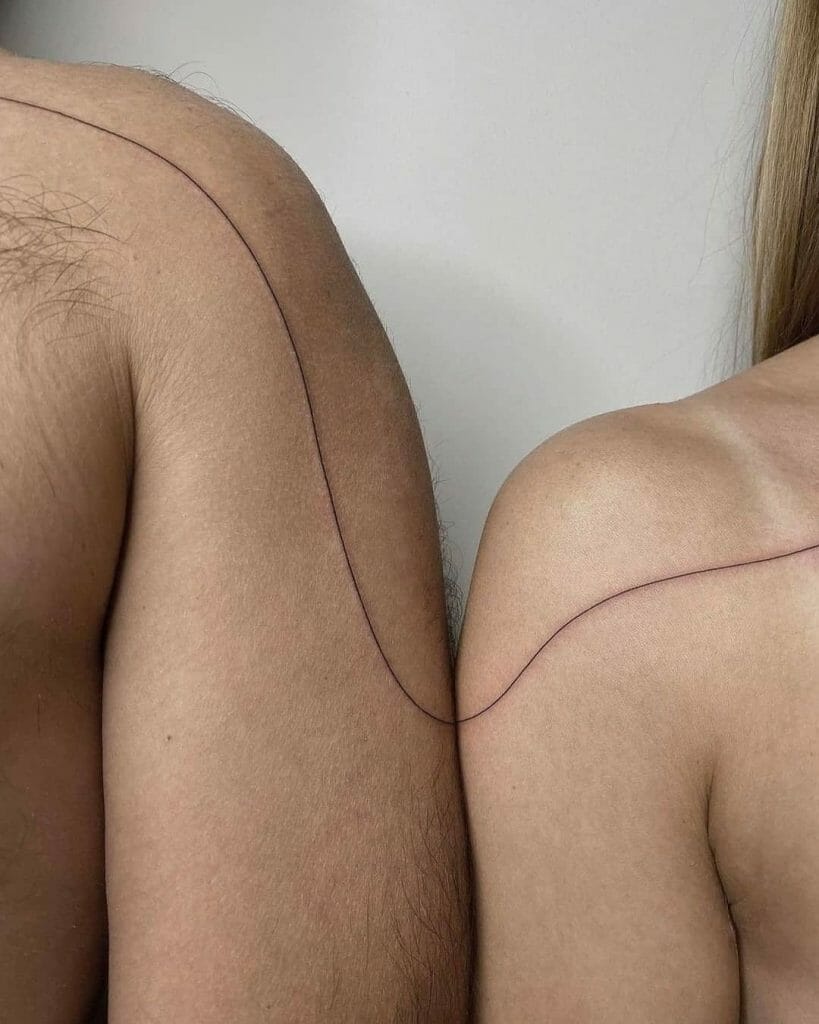 Matching pair of abstract line tattoos