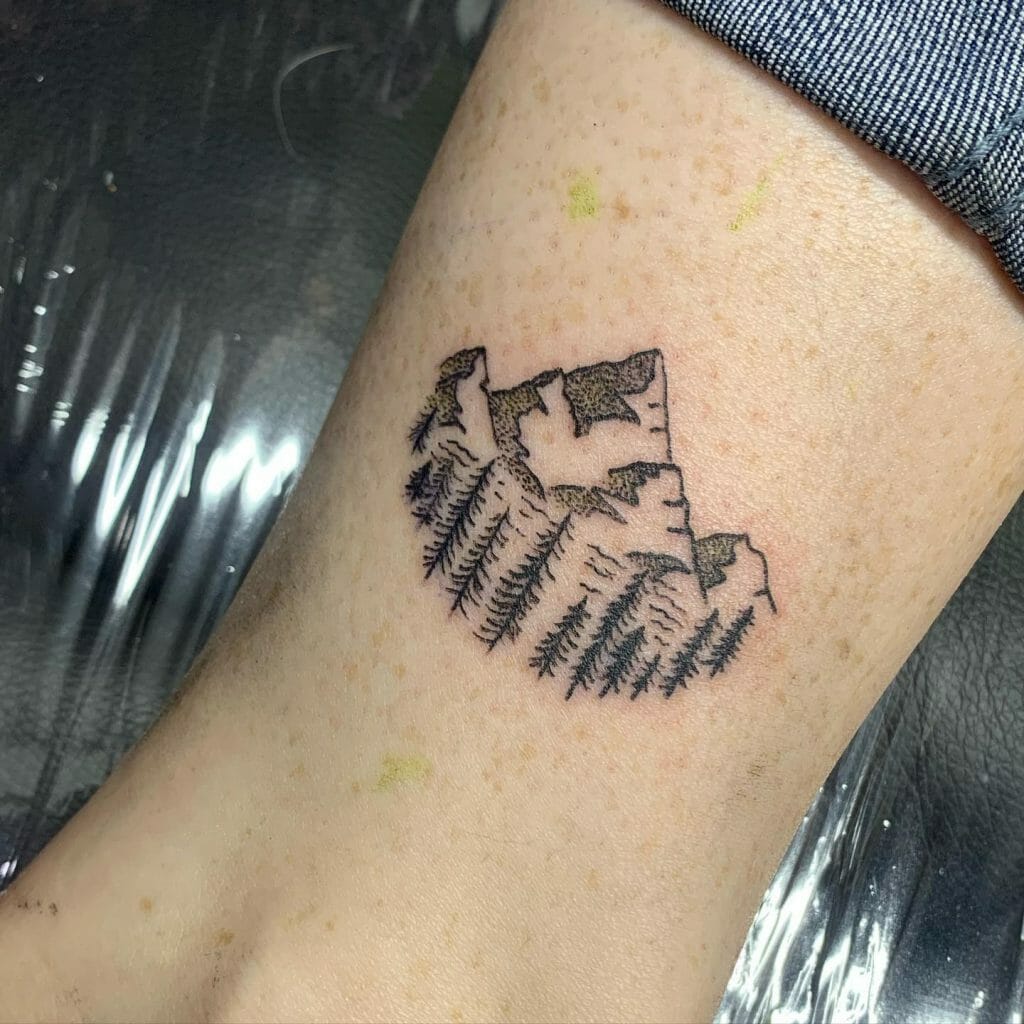 Minimalist mountain tattoo