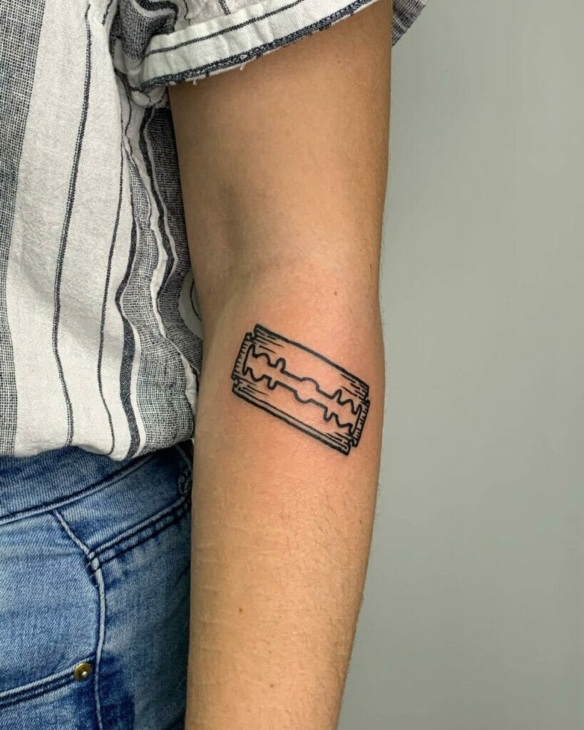 Minimalist razor blade tattoo