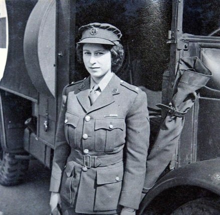 PRINCESS ELIZABETH, NOW QUEEN ELIZABETH II, LEARNING TO DRIVE AT THE MILITARY POLICE CENTER.  PICTURES FROM THE PHOTO ALBUM OF VIOLET WELLESLEY - 1945 PRINCESS ELIZABETH BEING TAUGHT TO DRIVE BY VIOLET WELLESLEY, MILITARY POLICE TRAINING CENTRE, CAMBERLEY, SURREY, UK