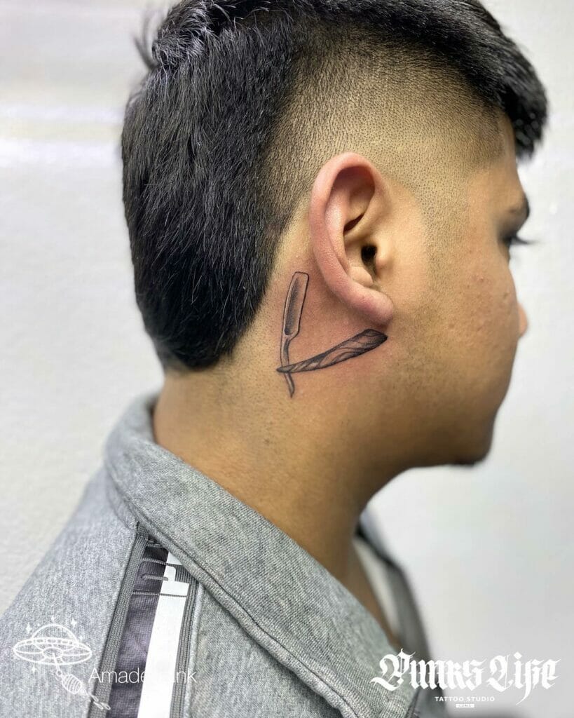 Razor blade behind the ear tattoo