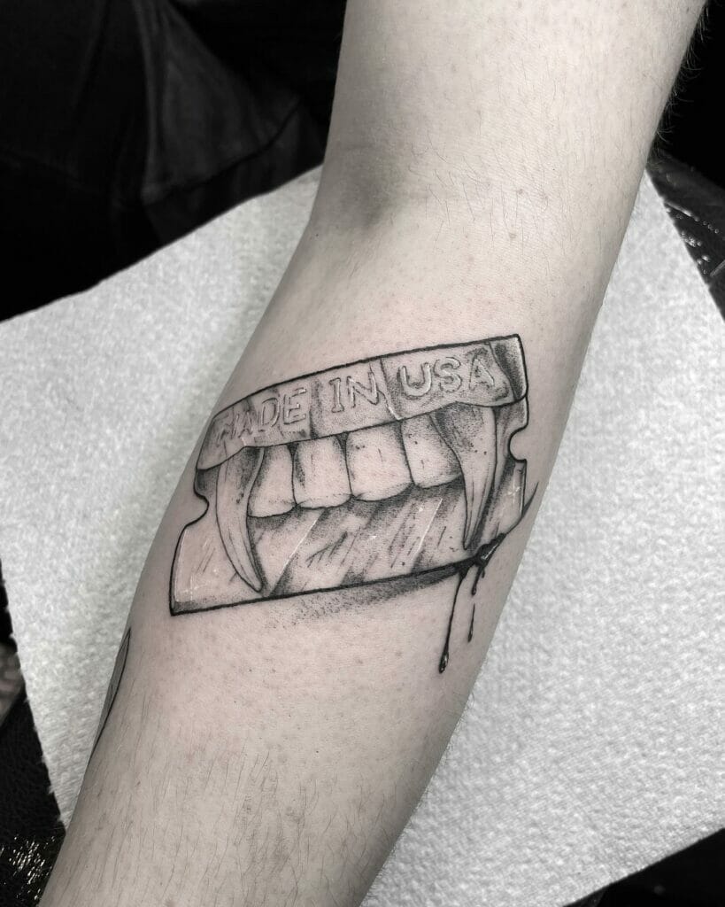 Razor blade tattoo with teeth