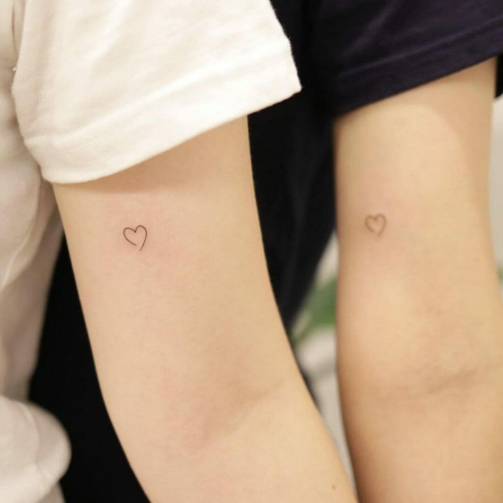 Tiny love tattoo for couples