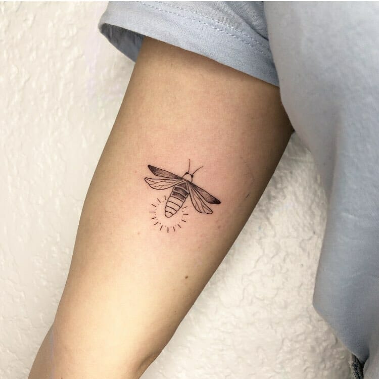 Traditional firefly tattoo for a timeless experience