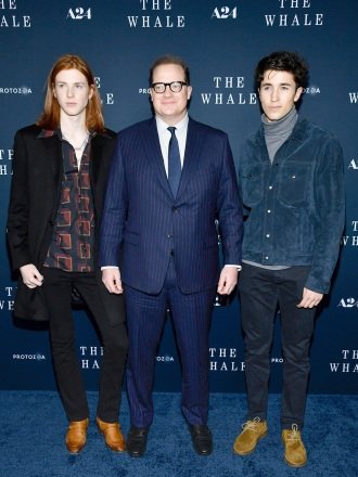 Actor Brendan Fraser, center, poses with his sons Leland Fraser, left, and Holden Fraser attend the premiere of "The whale" at Alice Tully Hall, in New York NY Premiere of "The whale"New York, United States – November 29, 2022
