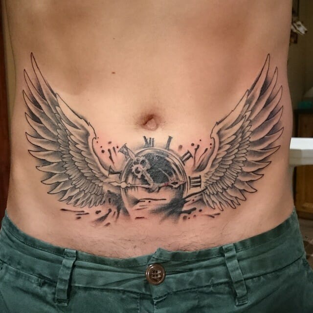Winged tattoo under the chest