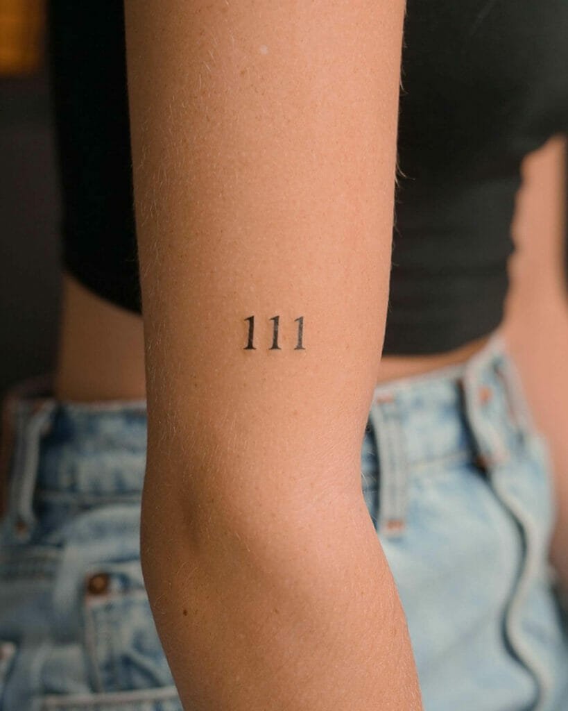 111 tattoo on the arm