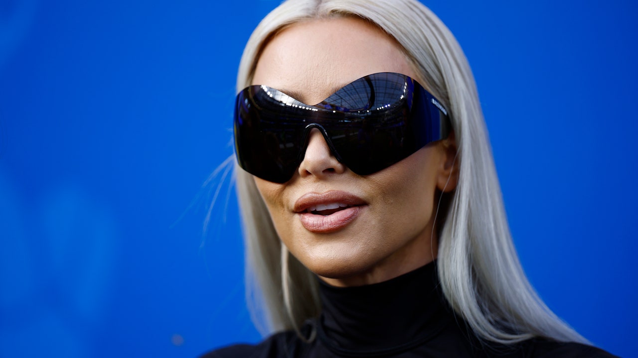 Kim Kardashian debuted honey blonde hair while wearing a tiny latex top – see photos

+2023