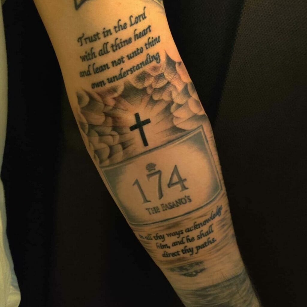 Forearm cross with clouds and inspirational quotes tattoo