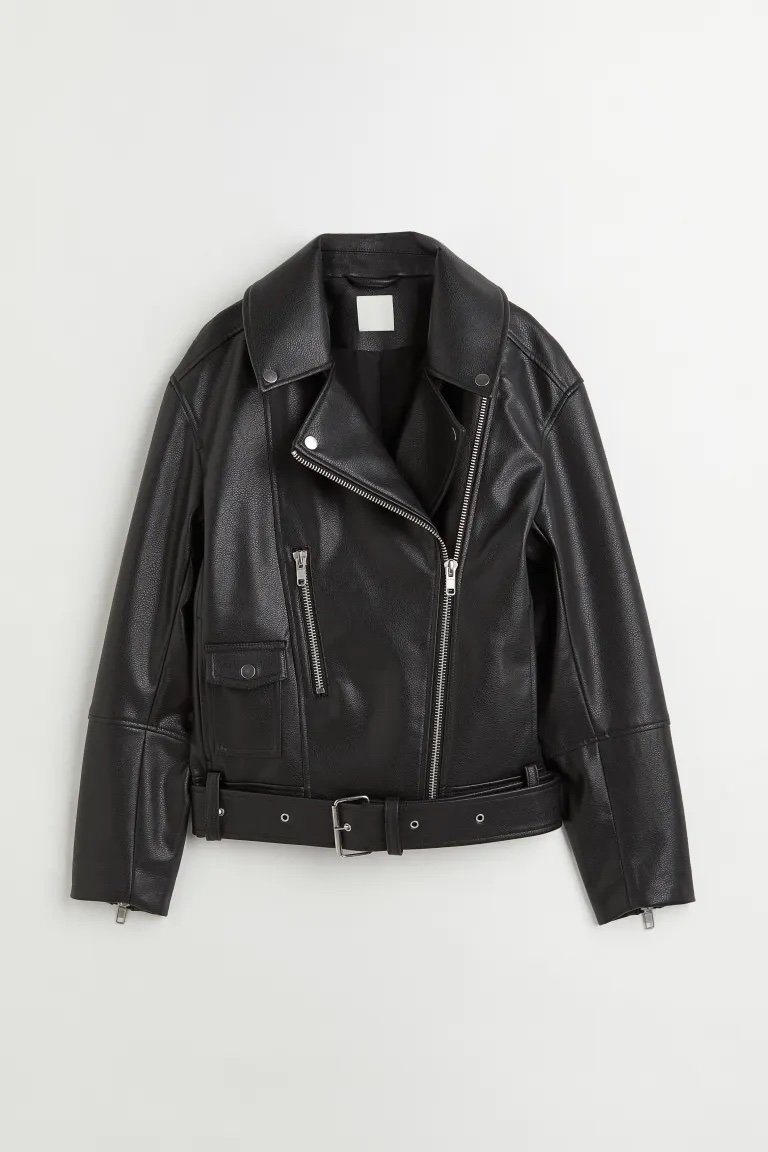 Classic biker jacket in faux leather with a diagonal zip down the front and notch lapels with decorative press-studs.  Front zip pocket, small patch pocket with flap and press-stud, and discreet side pockets.  Belt with metal buckle at the hem and zip at the cuffs.  lined.