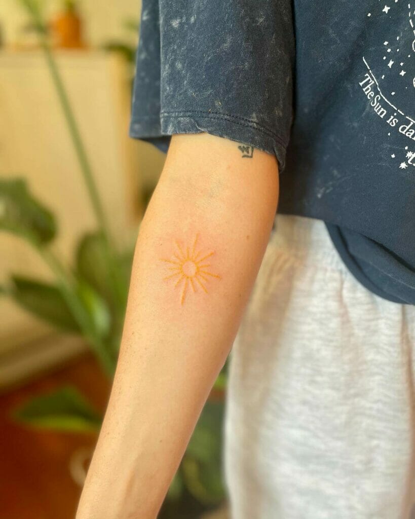 Yellow color sunshine tattoo