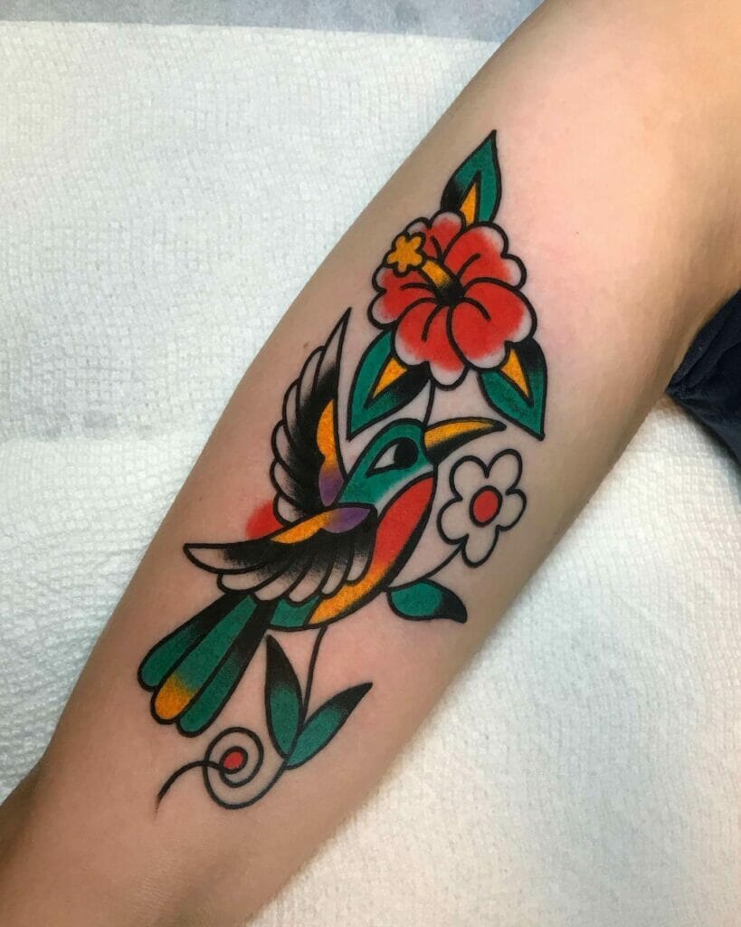Traditional hummingbird tattoo design with flowers