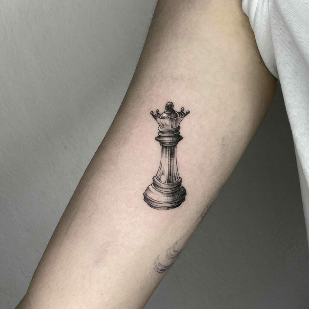 Magnificent black queen chess piece tattoo