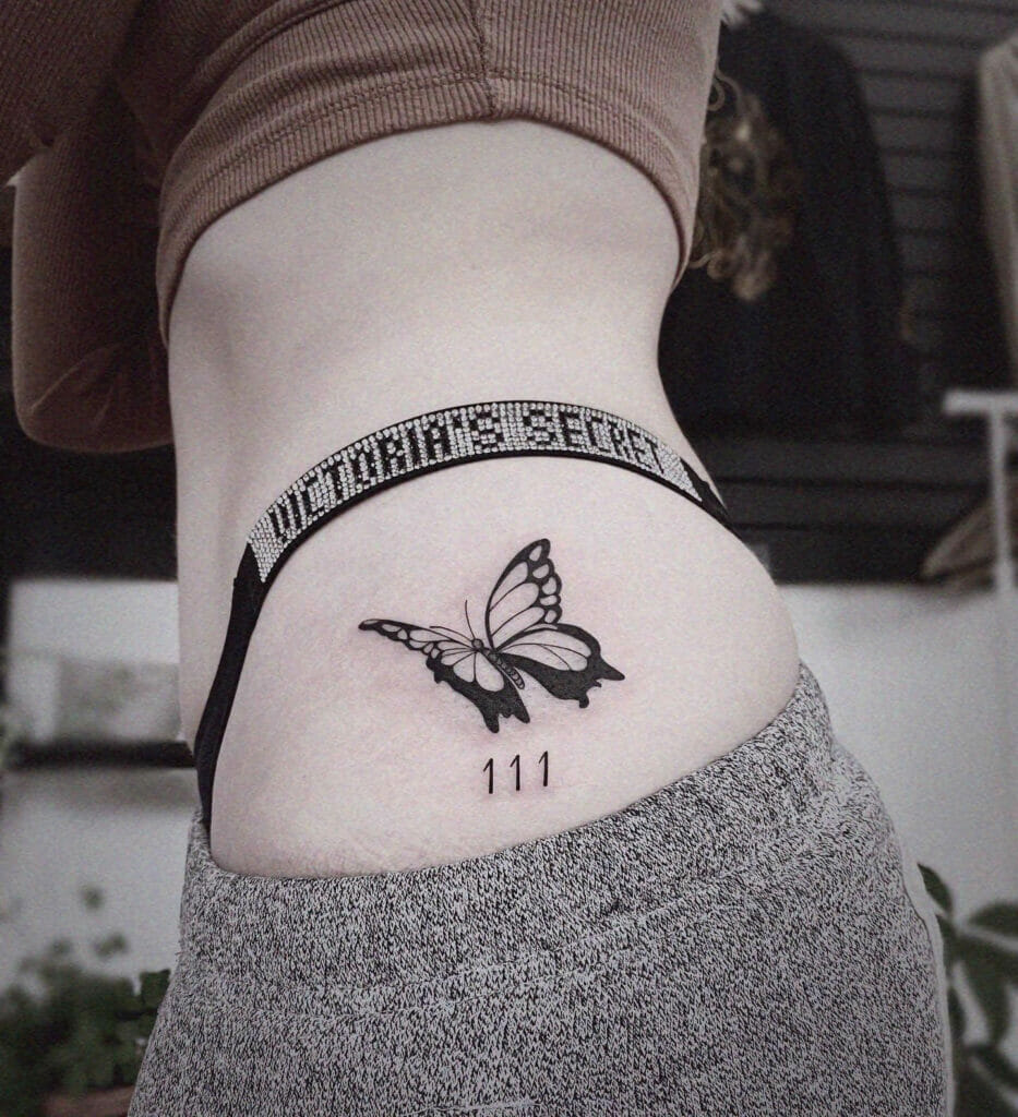 111 tattoo with a butterfly