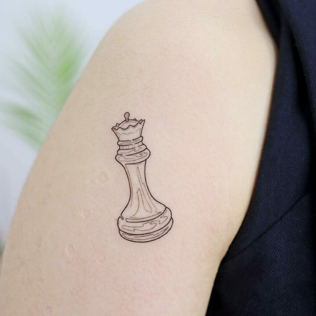 Right Bicep Tiny Queen Chess Piece Tattoo Design