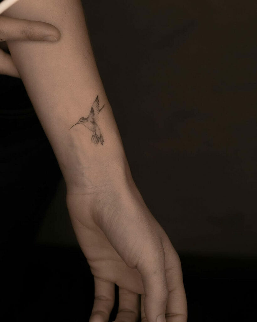 Awesome small hummingbird tattoo for men