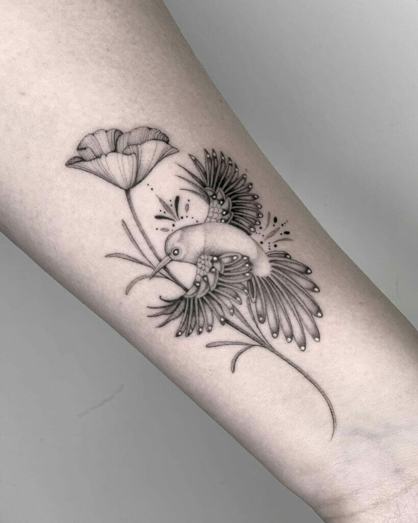 Poppy and hummingbird tattoo design done in black ink