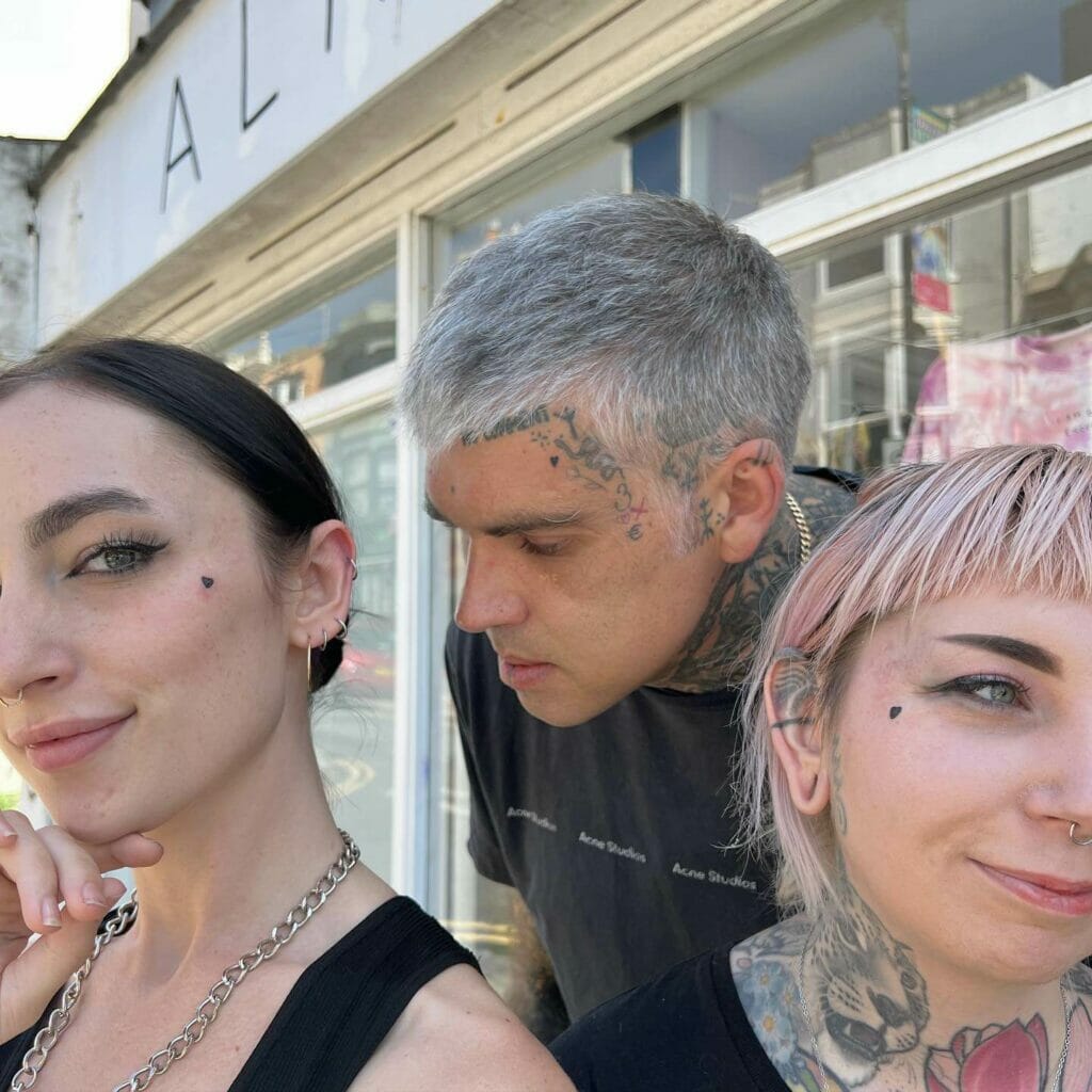 Matching heart tattoo on face