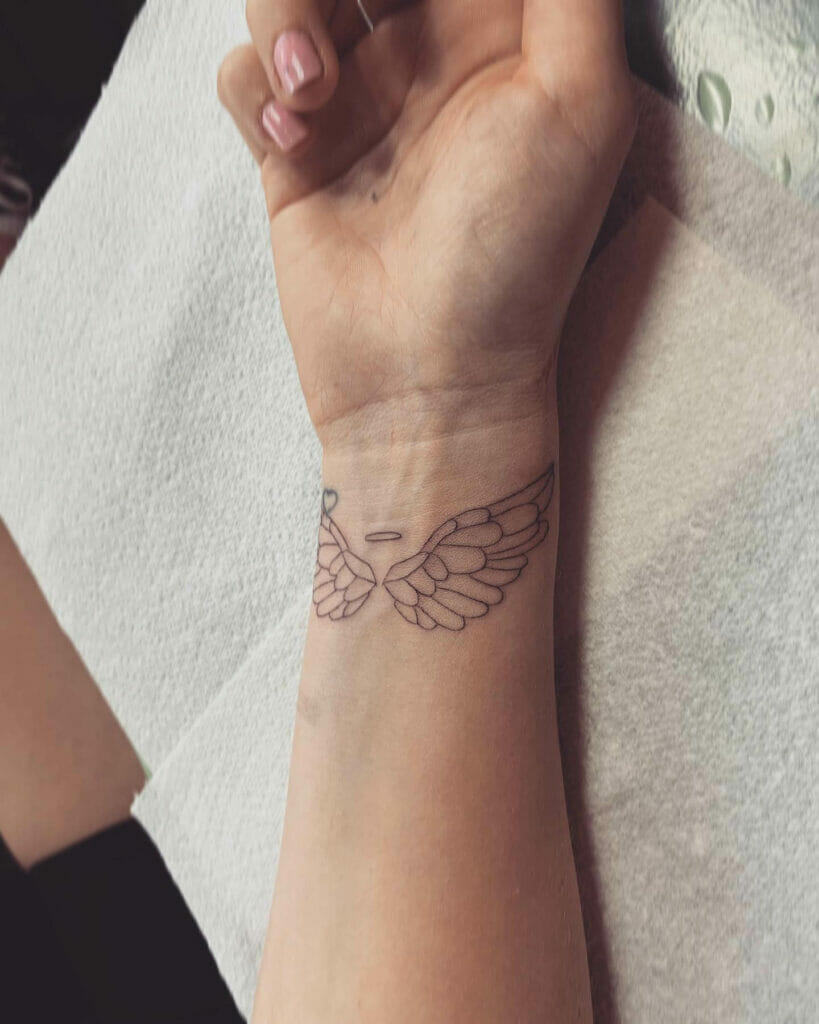 Simple angel wing tattoo