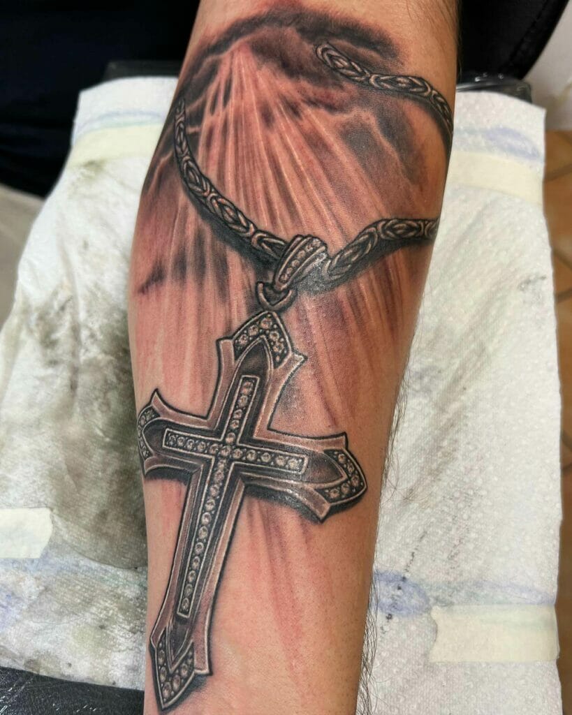 Cross tattoo with clouds and sunbeams