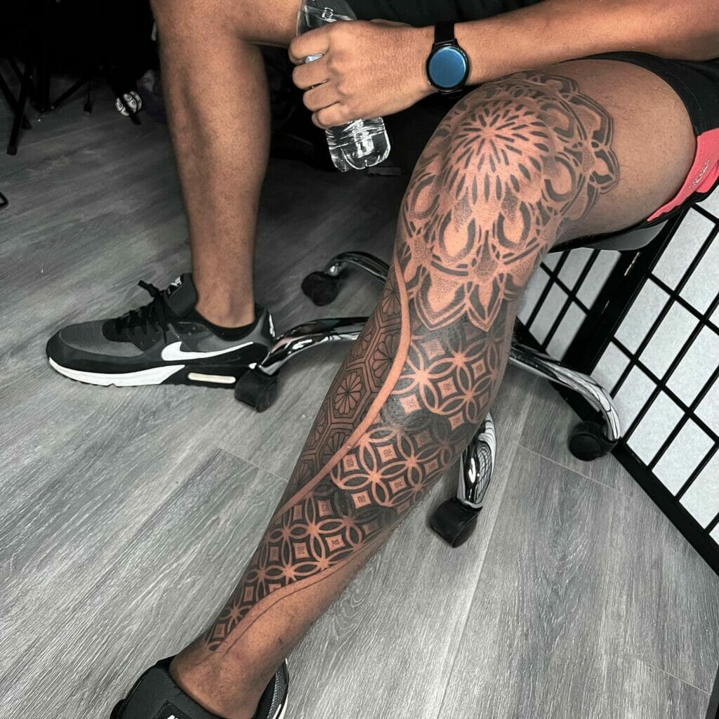 Vivid intricate mandala tattoo done in single black ink