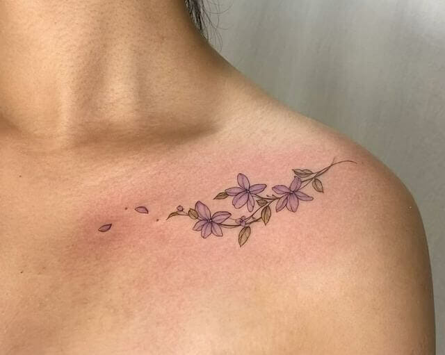 Lovely colorful floral motif collarbone tattoos