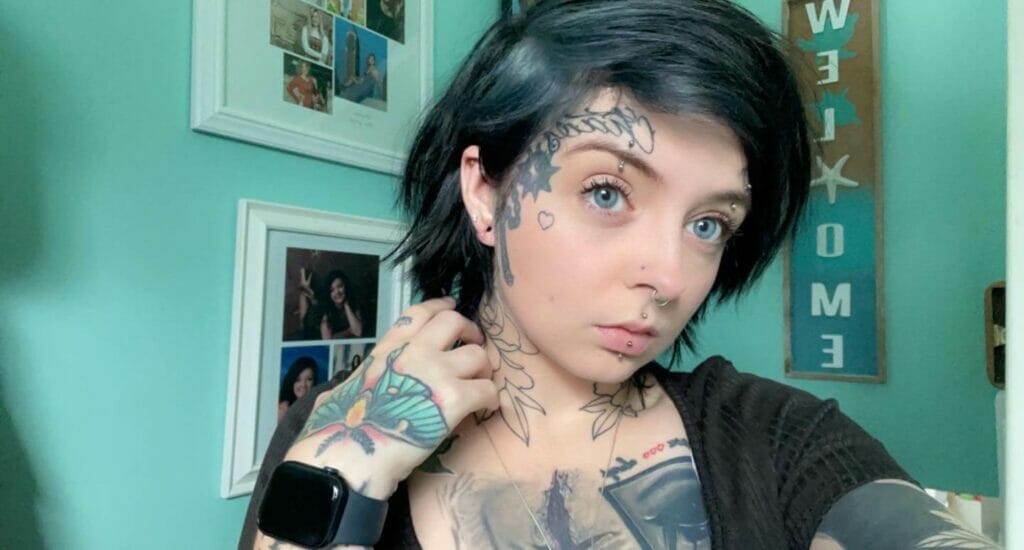 Heart black tattoo on face