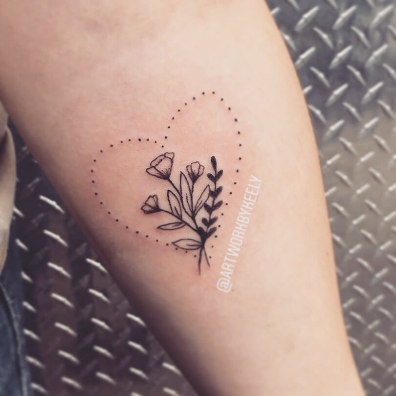 Flower stem tattoo enclosed in heart