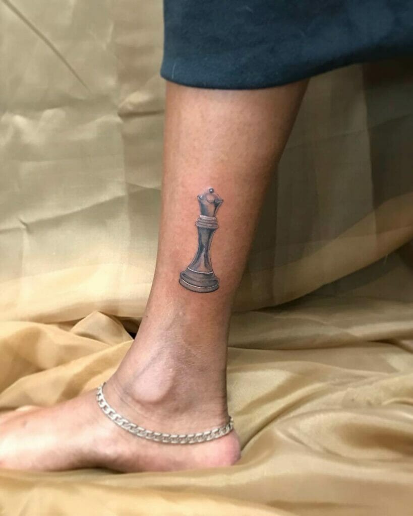 Right leg queen chess piece tattoos